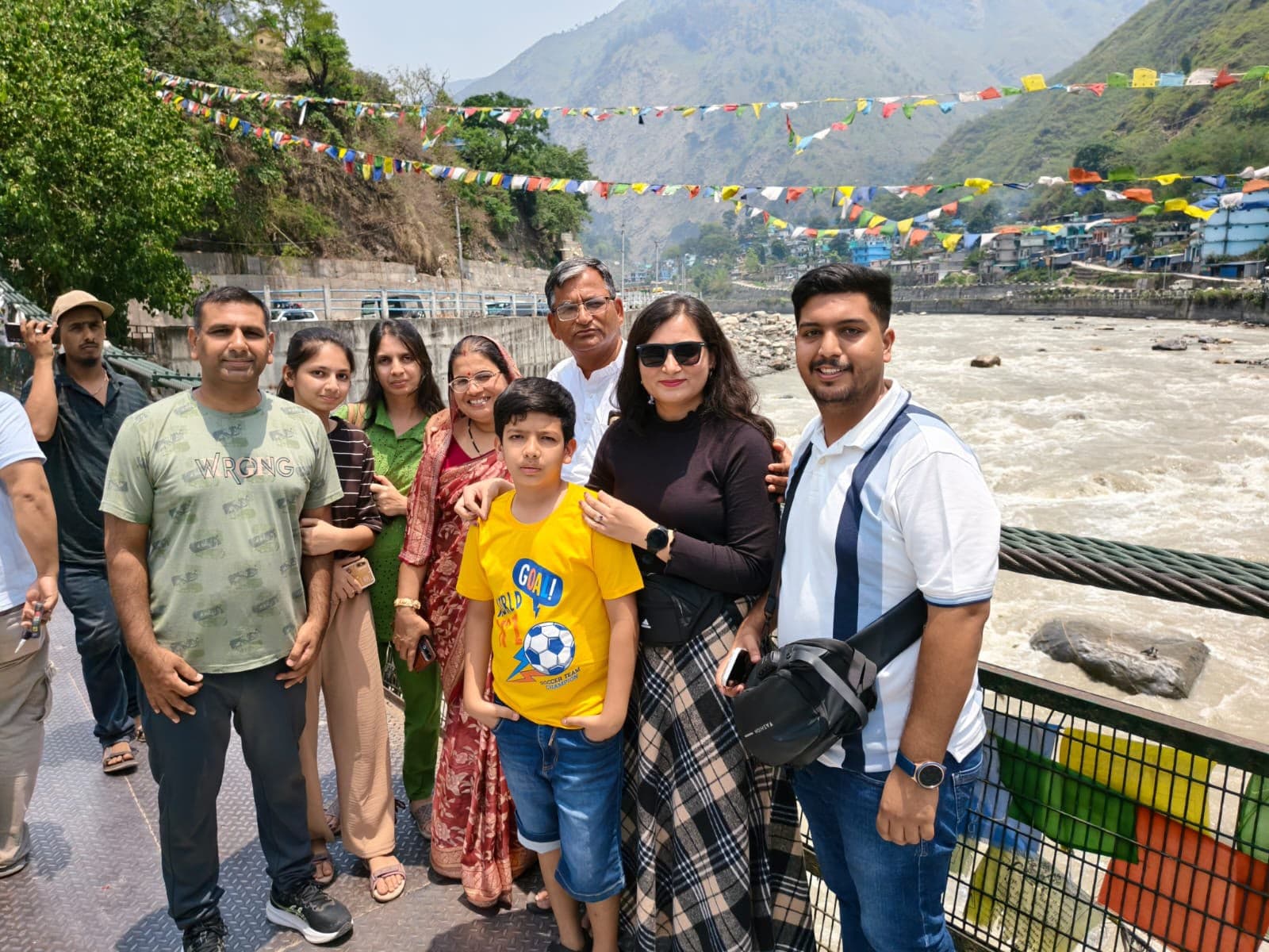 Family group on the bridge over the Kali river, Dharchula